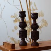 Pair of turned and carved wooden candlesticks