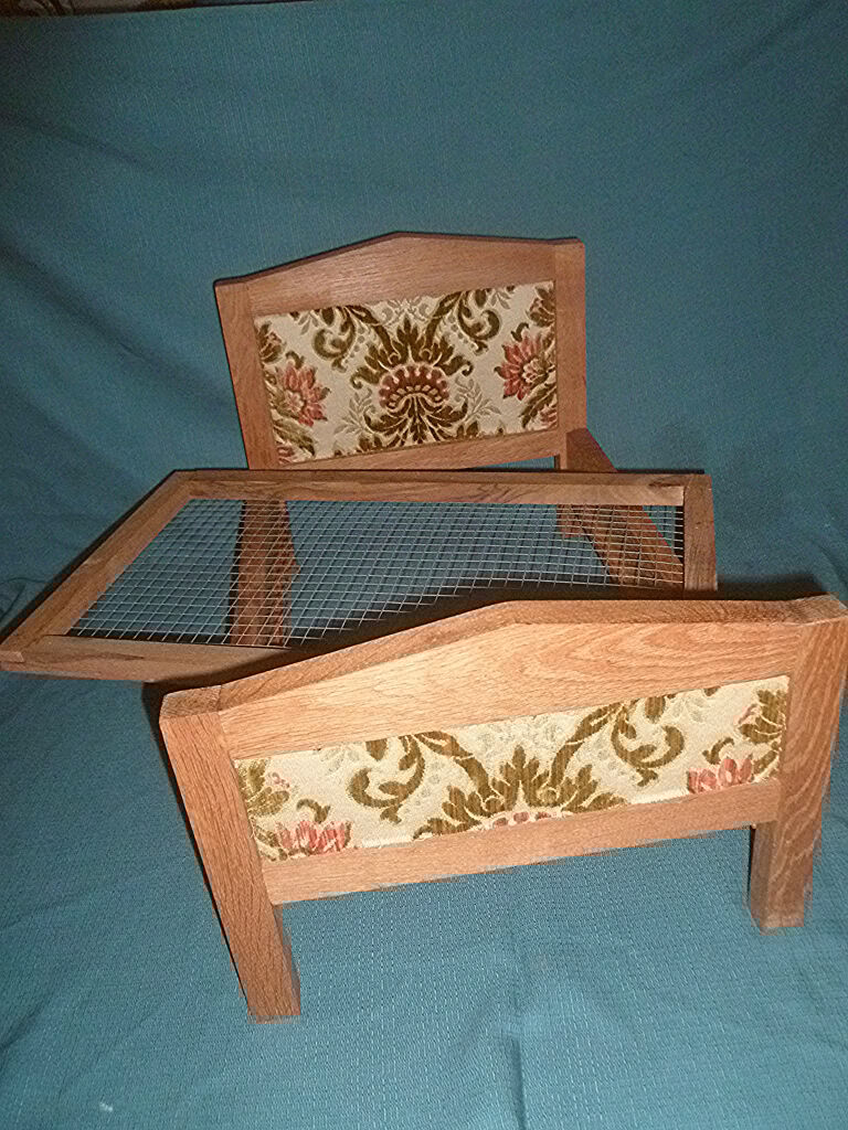 Vintage handcrafted wooden doll bed