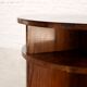Table basse circulaire moderniste française avec étagères, vers 1935