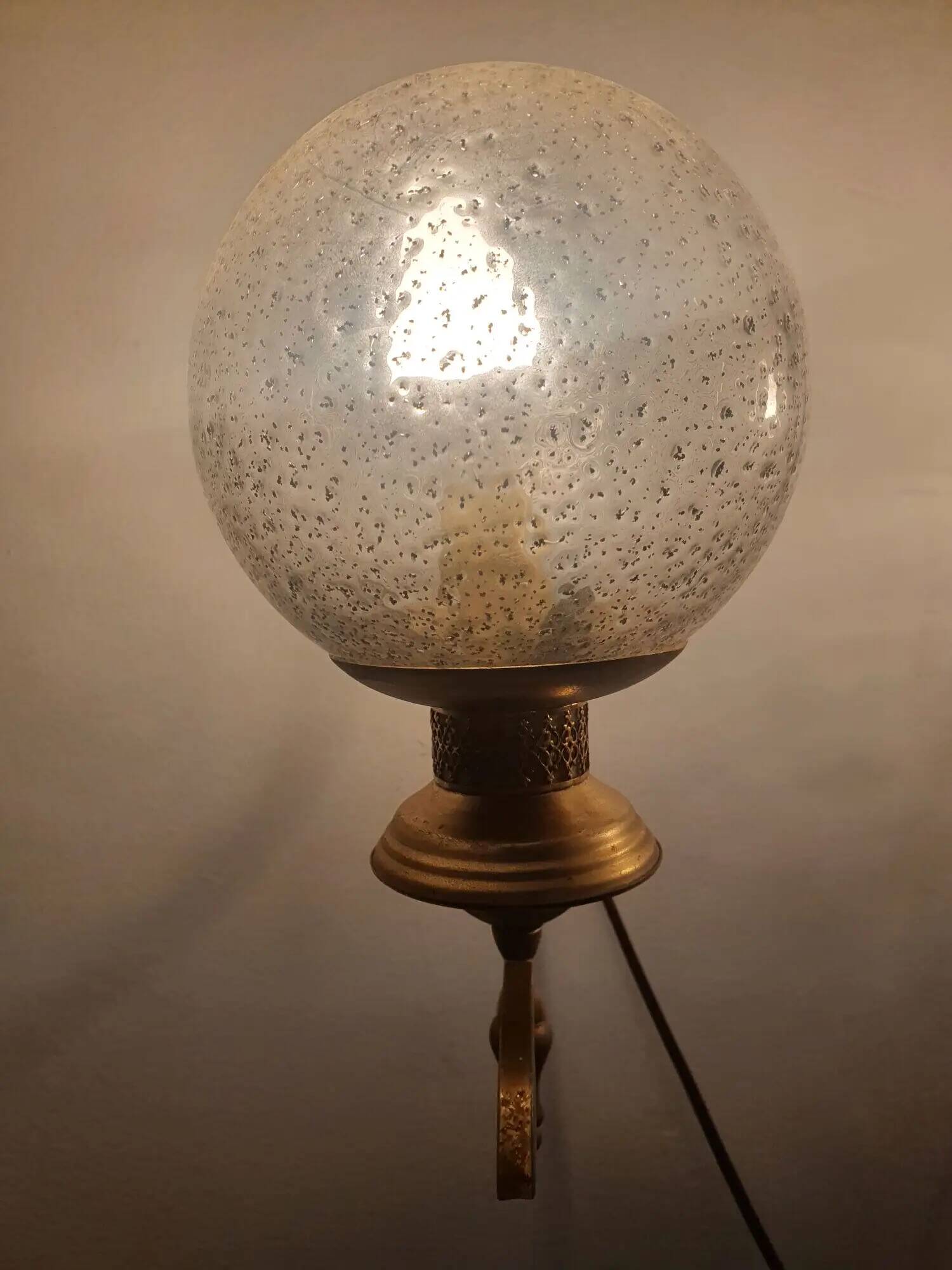 Pair of vintage gold wall sconces with transparent globes