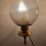 Pair of vintage gold wall sconces with transparent globes