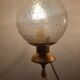 Pair of vintage gold wall sconces with transparent globes