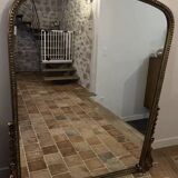 Large gilded mirror with pediment
