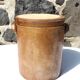 Trio of stoneware pots with lids