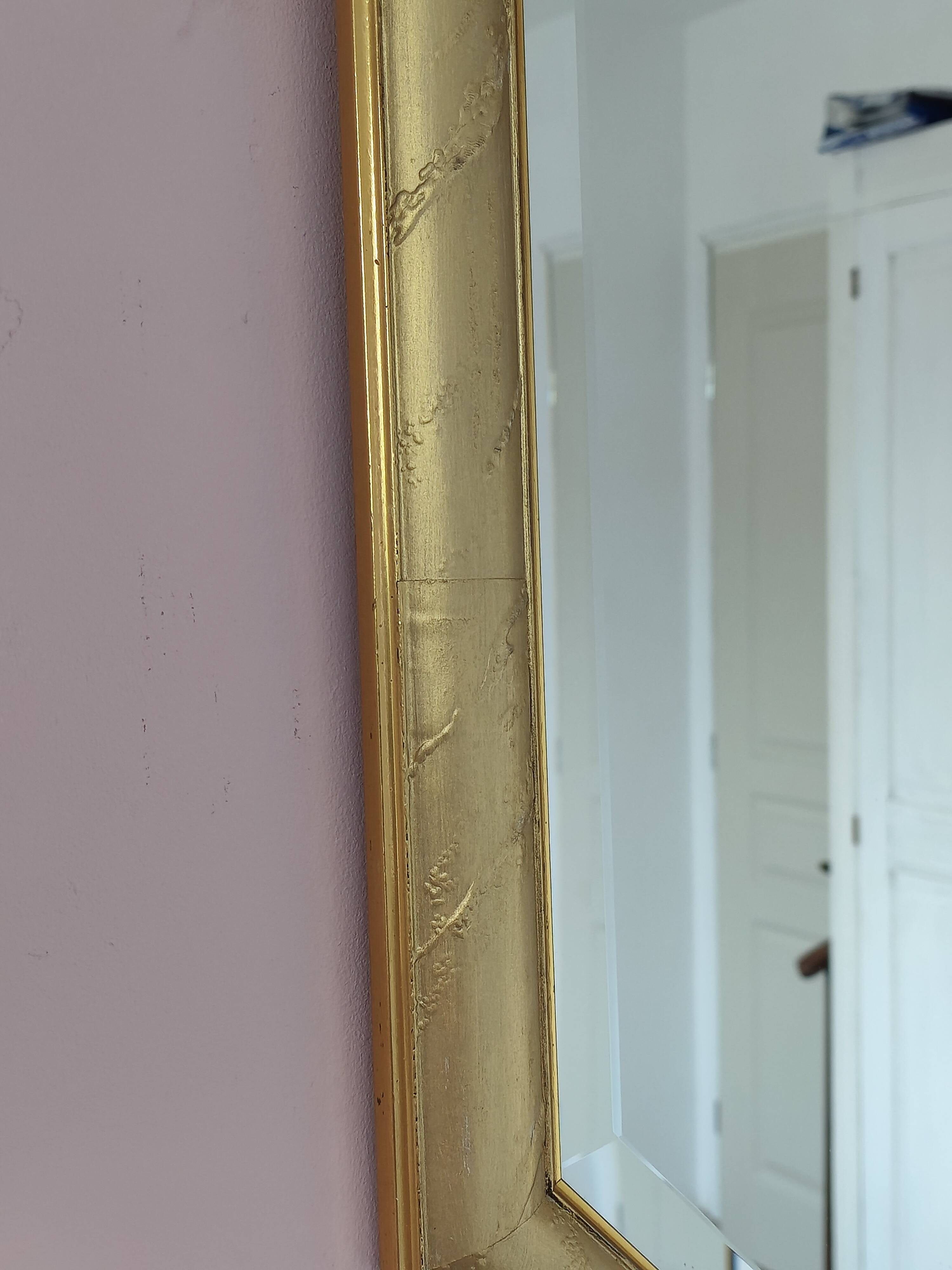 Golden octagonal mirror with bevelled glass from the 1970s.