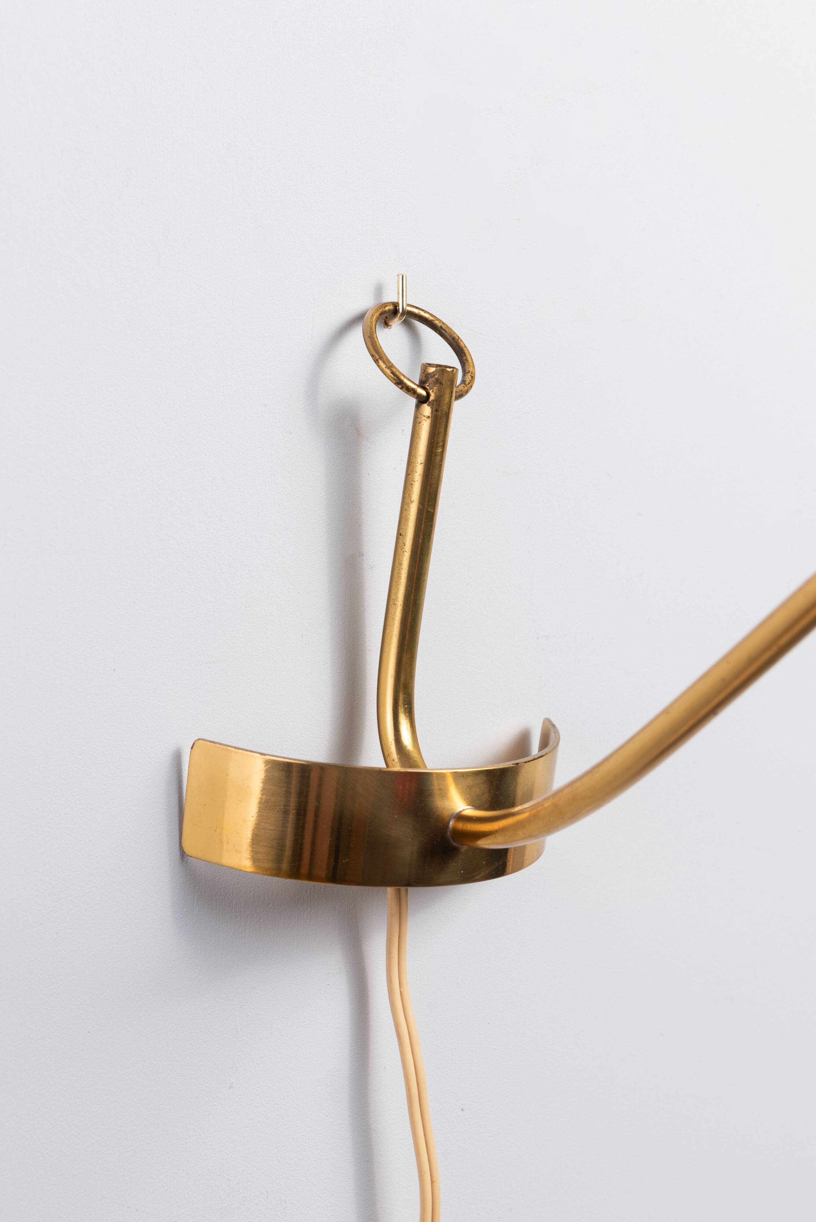 Brass wall lamp with perforated metal shade, 1950s, Sweden