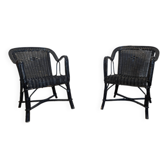 Pair of black rattan armchairs