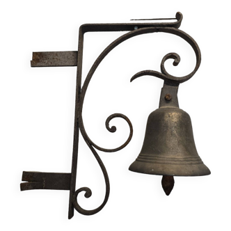 Old wall bell in bronze and wrought iron