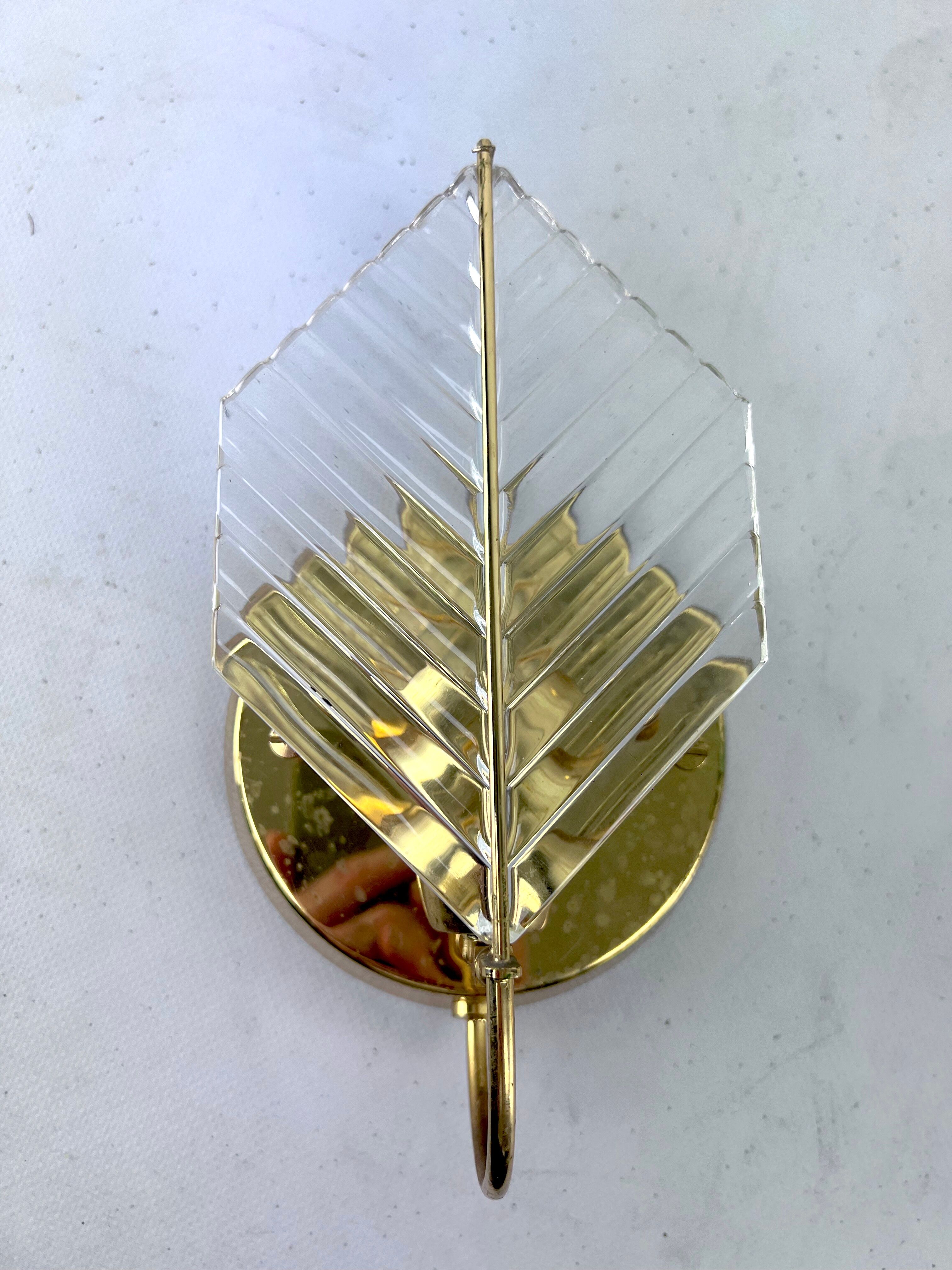 Vintage set of three sconces in brass and glass by Zero Quattro. Italy 1970s