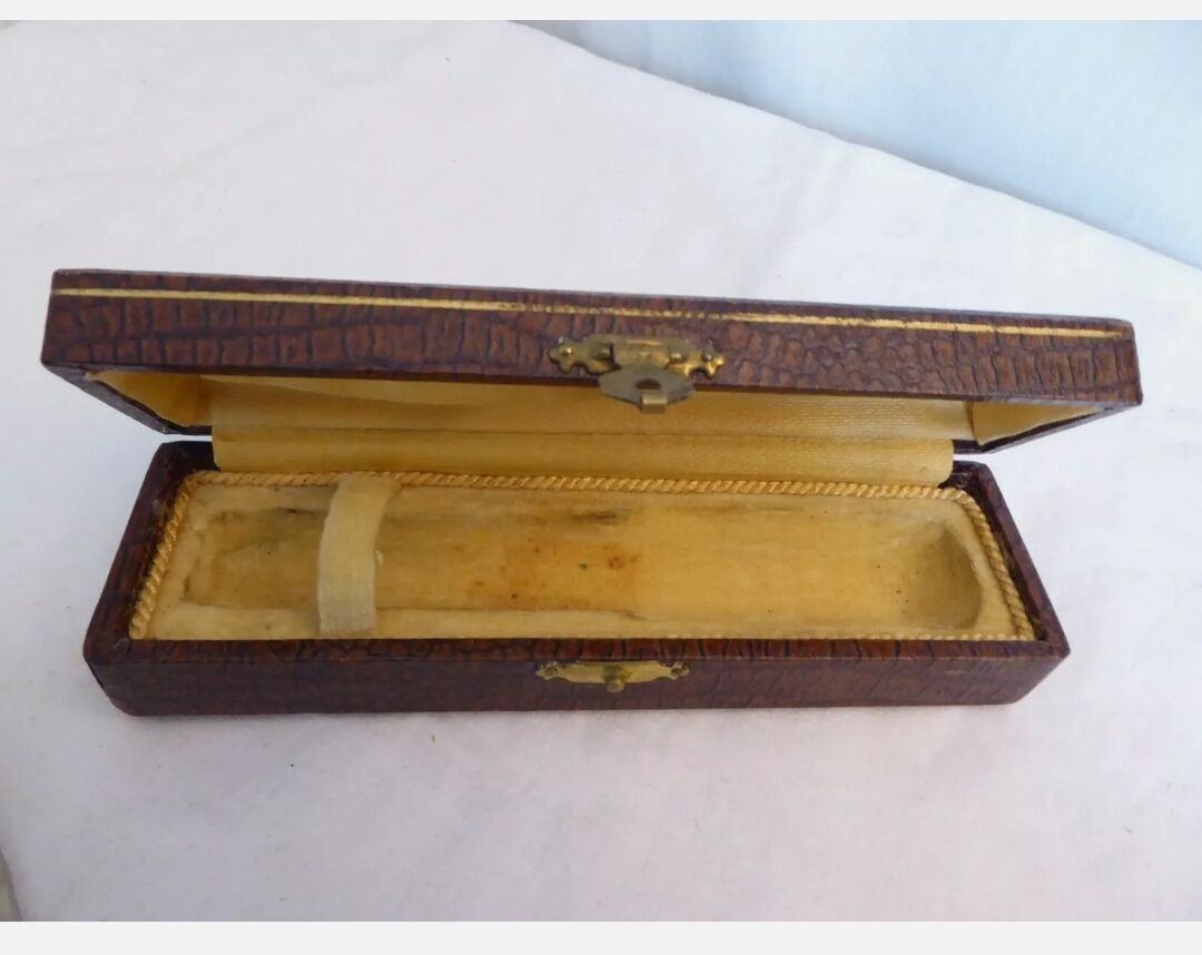 Silver metal sugar clamp in its case