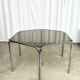 Vintage hexagonal table with smoked glass top and chrome metal structure.