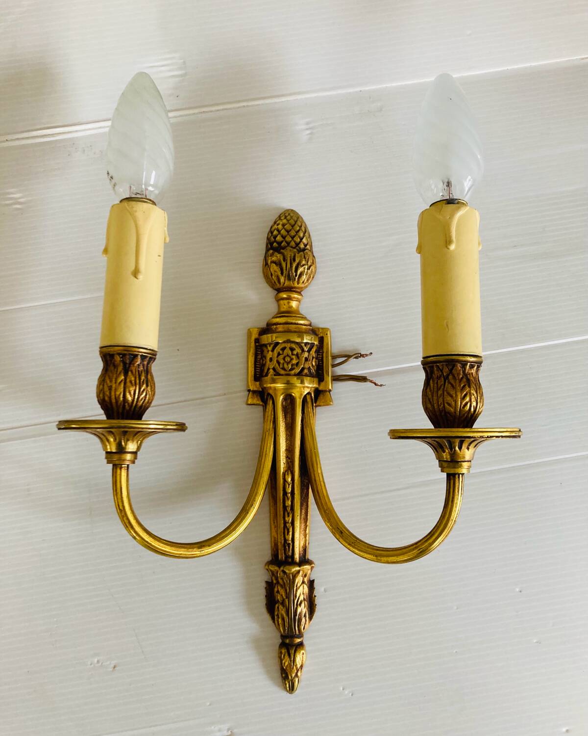 St Louis XVI gilded bronze wall lights with foliage and pine cone decorations