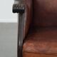 Classic vintage wingback chair in sheepskin and wood