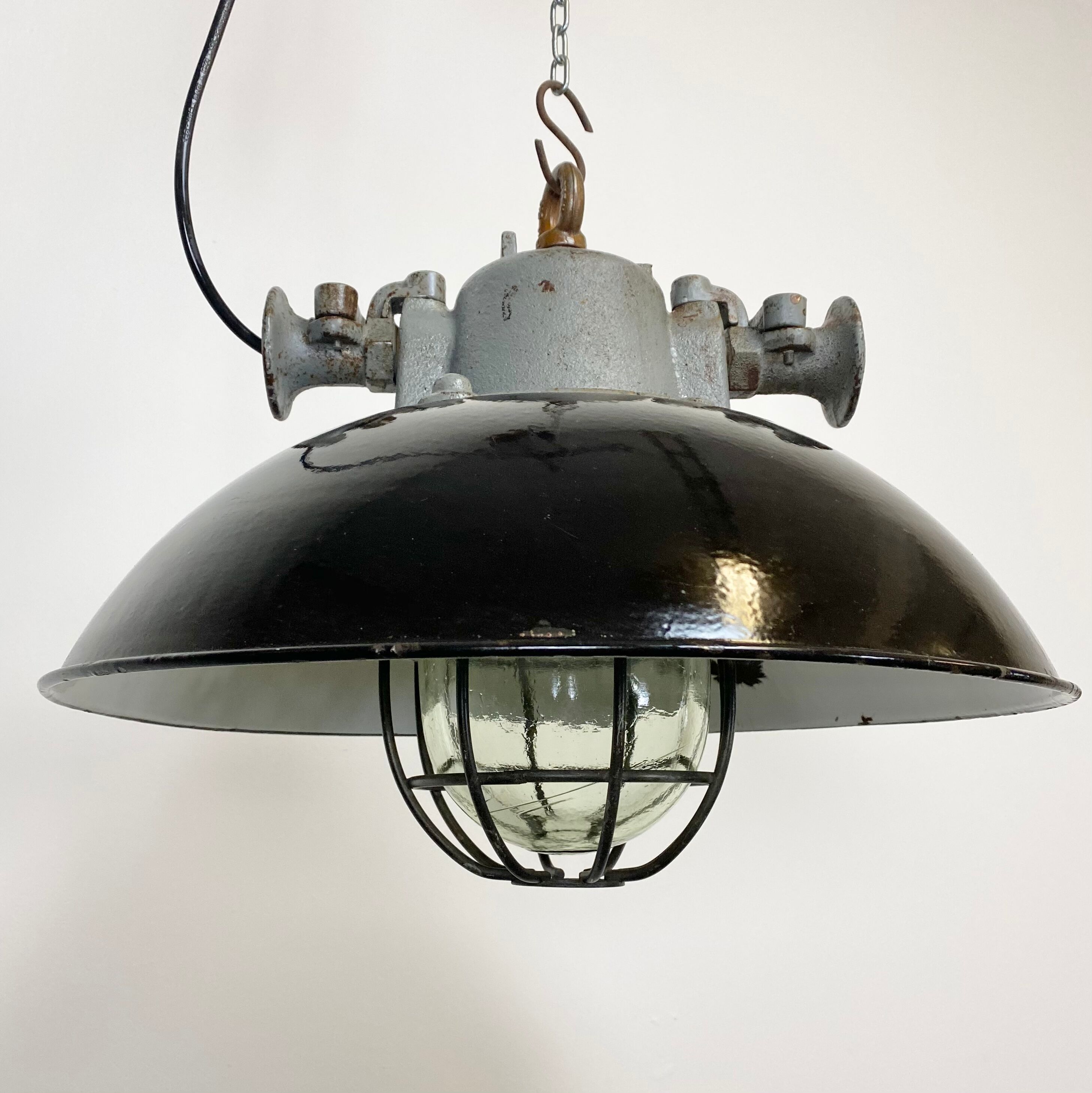Black enamel and cast iron industrial cage pendant lamp, 1950