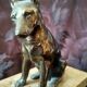 Greenhouse book dog sculpture regulates on marble slab