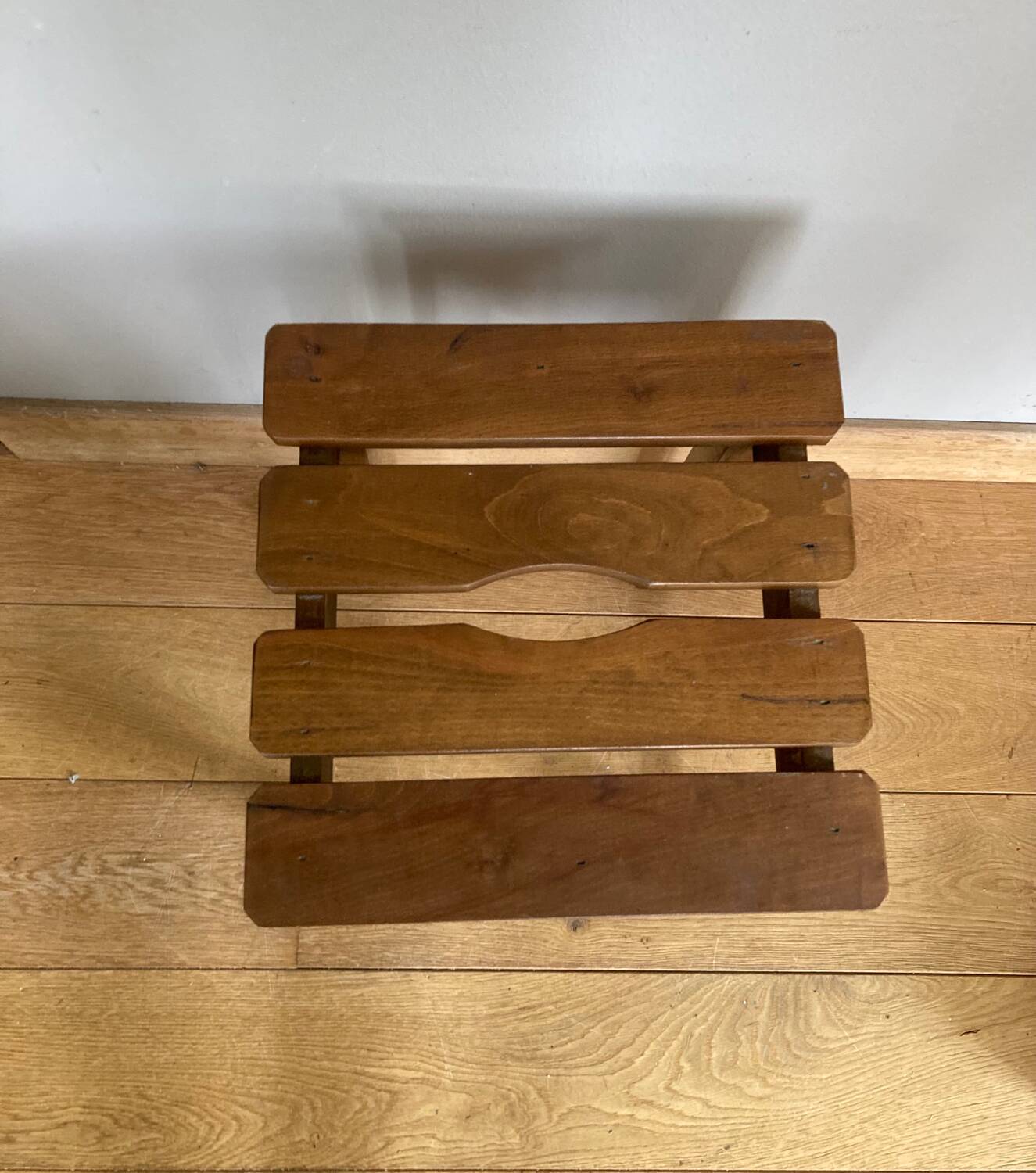 Wooden stool with central grip, quadripod base, 20th century