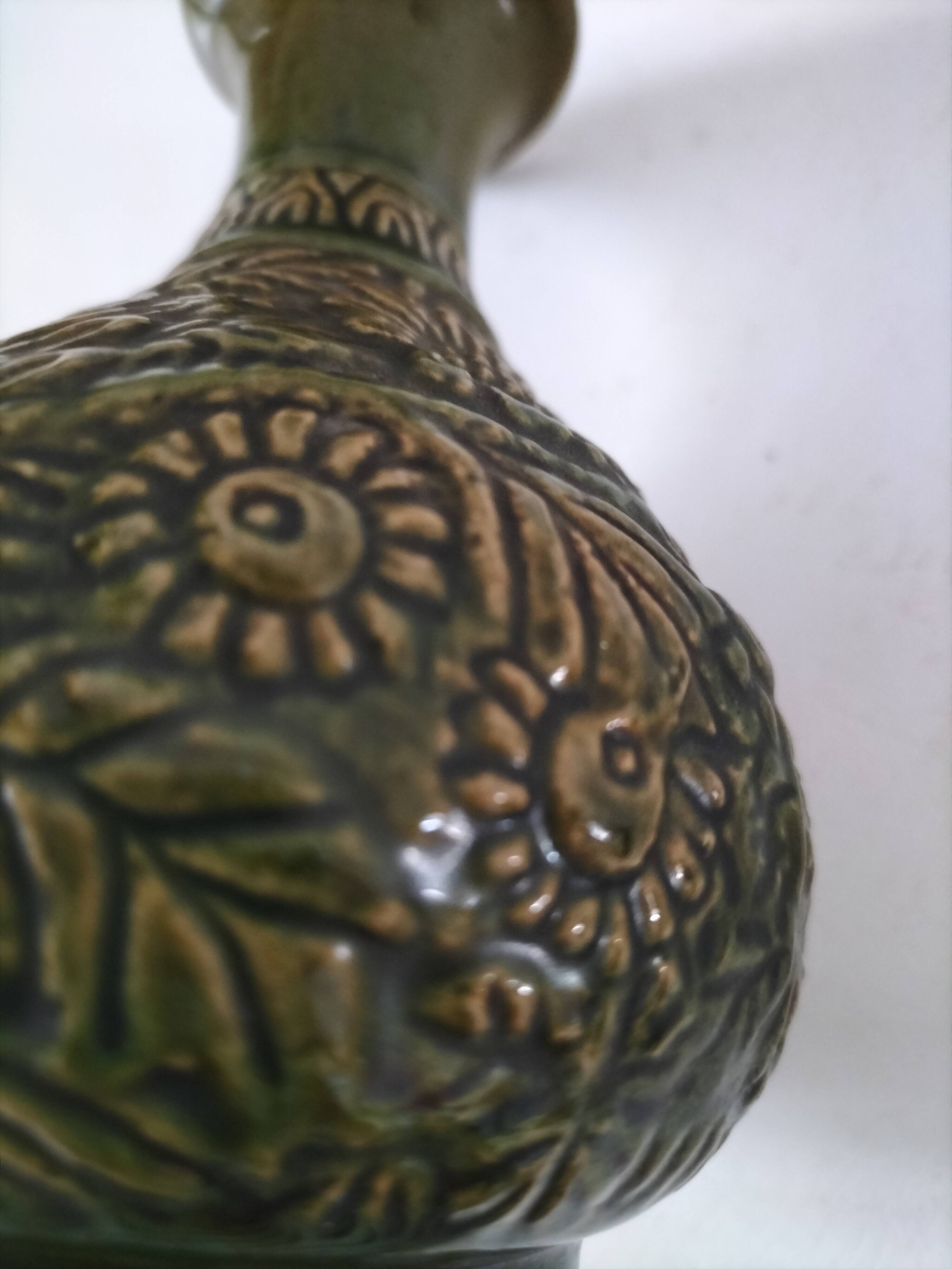 Small glazed vase with raised floral decoration