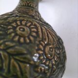 Small glazed vase with raised floral decoration