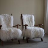 Pair of Scandinavian armchairs in oak and long-haired Icelandic sheepskin by Henning Kjærnulf, 1950.