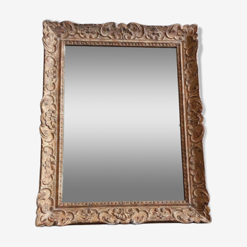 Large Montparnasse rocaille style frame in carved wood mounted in mirror.