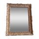 Large Montparnasse rocaille style frame in carved wood mounted in mirror.