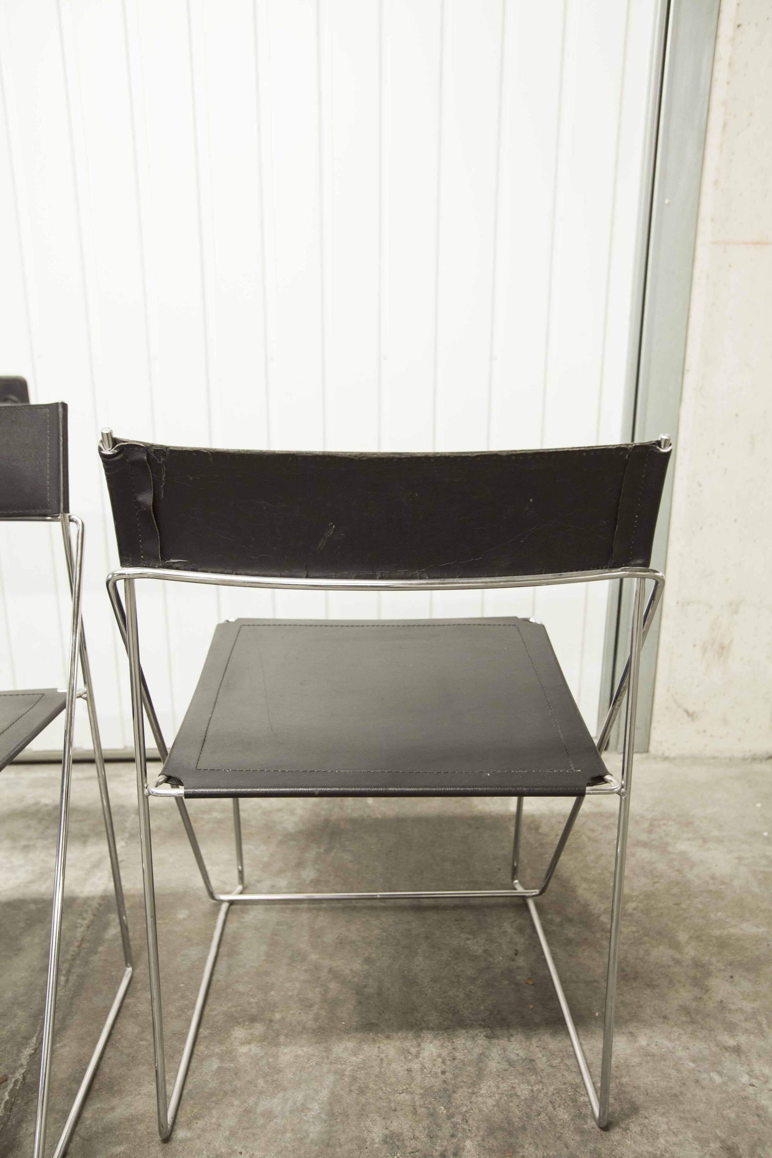 Set of 3 minimalist X line chairs by Niels Jorgen Haugesen.