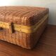 Vintage braided wicker suitcase