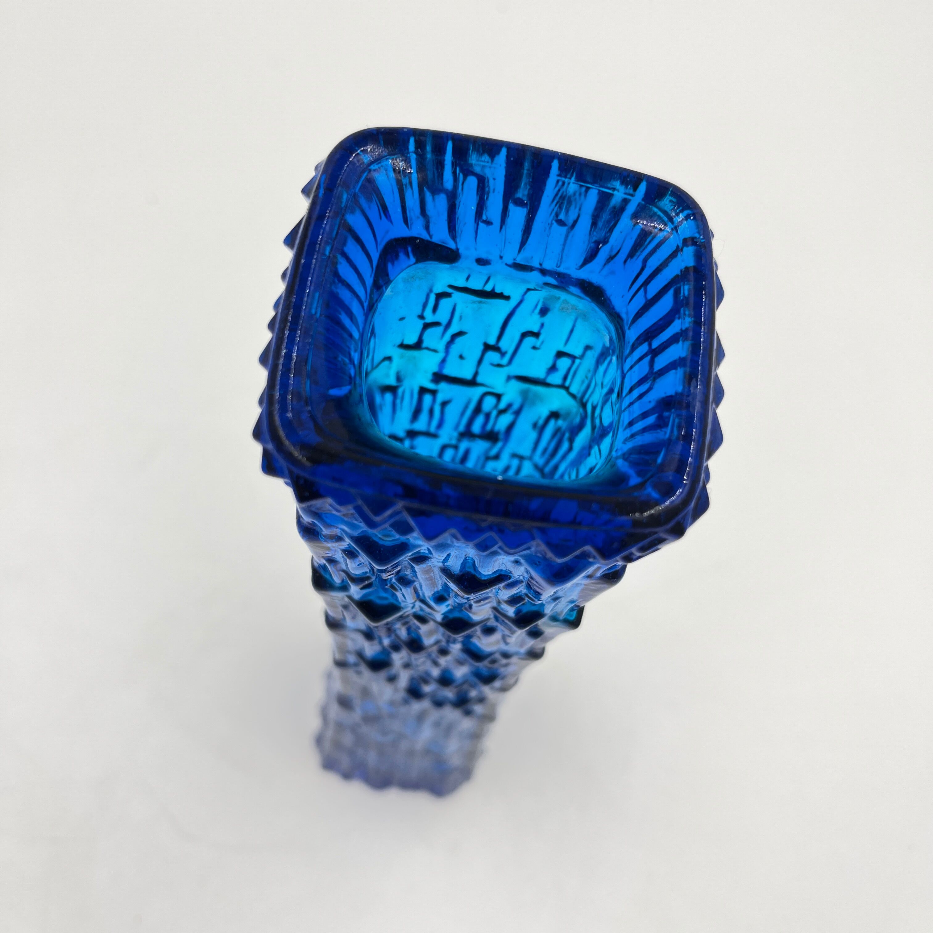 Blue glass vase with relief