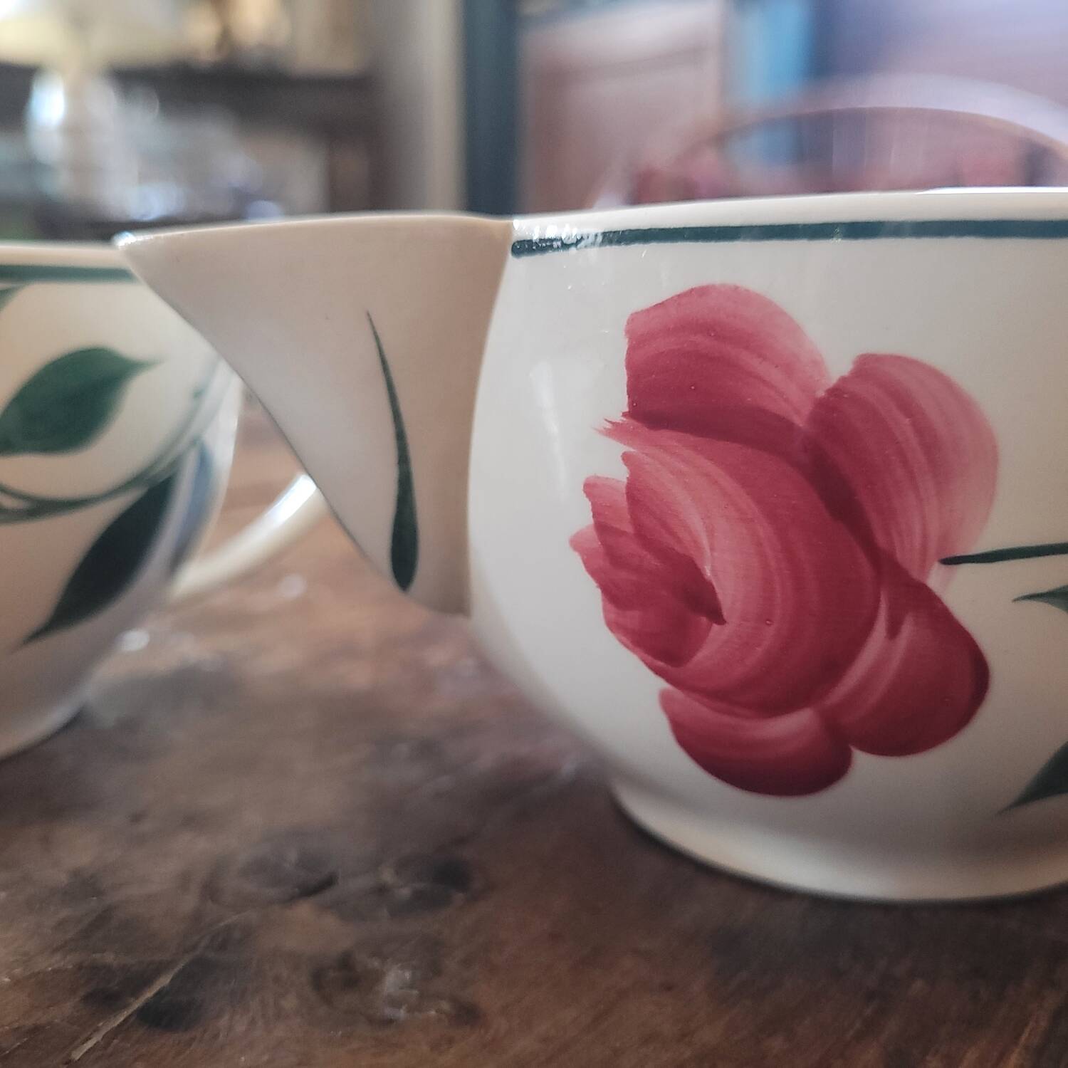Pair of hand-painted floral-decorated jugs