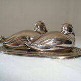 Salt and pepper shaker on silver metal tray in the shape of a duck art deco style