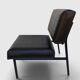 Modernist armchair in black faux leather and metal – 1960s