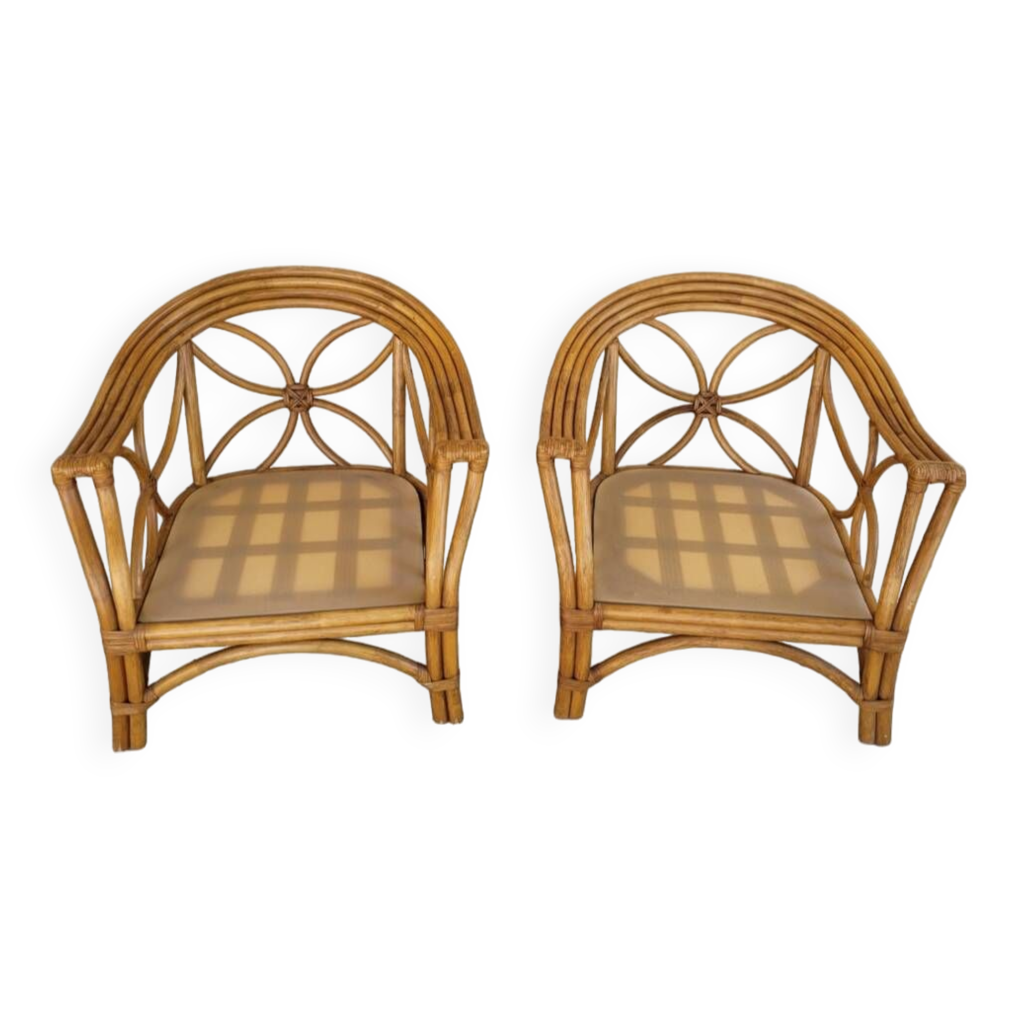 Two large rattan armchairs