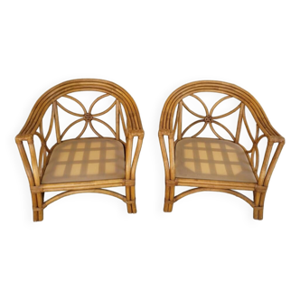 Two large rattan armchairs