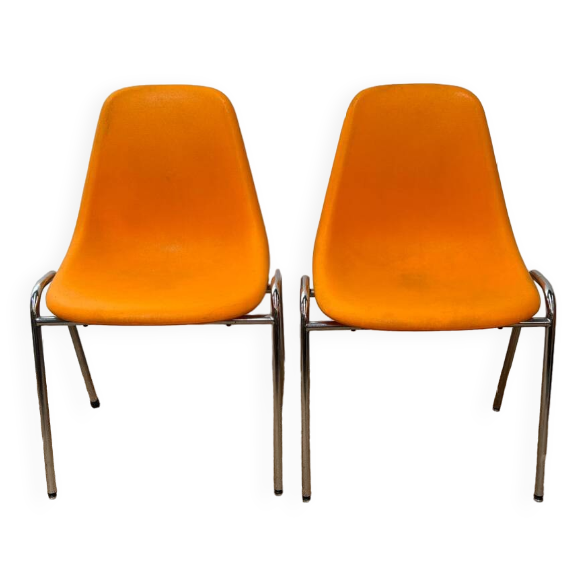 Two orange plastic pollak chairs at Orly airport
