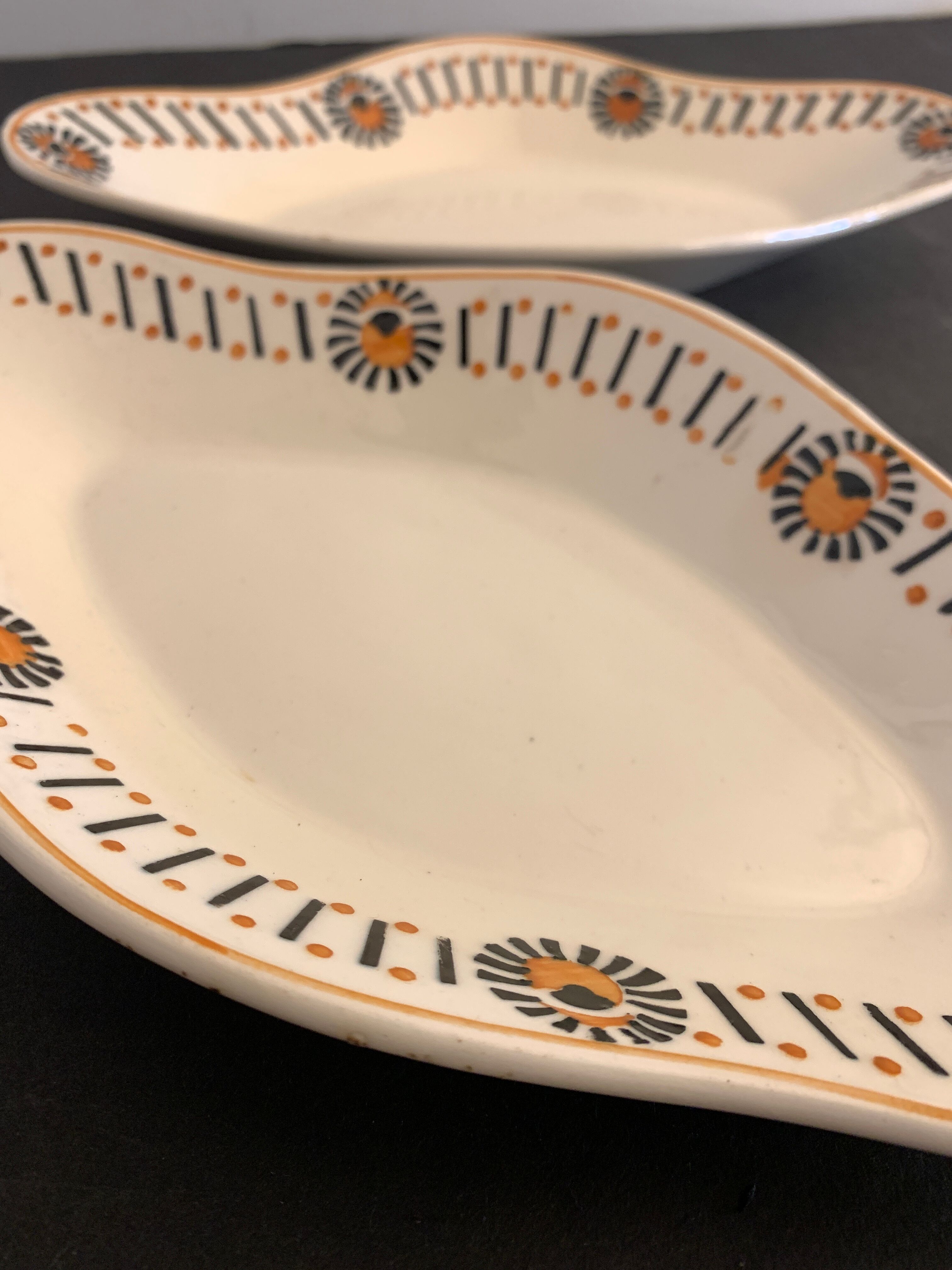 Pair of art deco raviers signed Longwy and numbered, model Gerazine