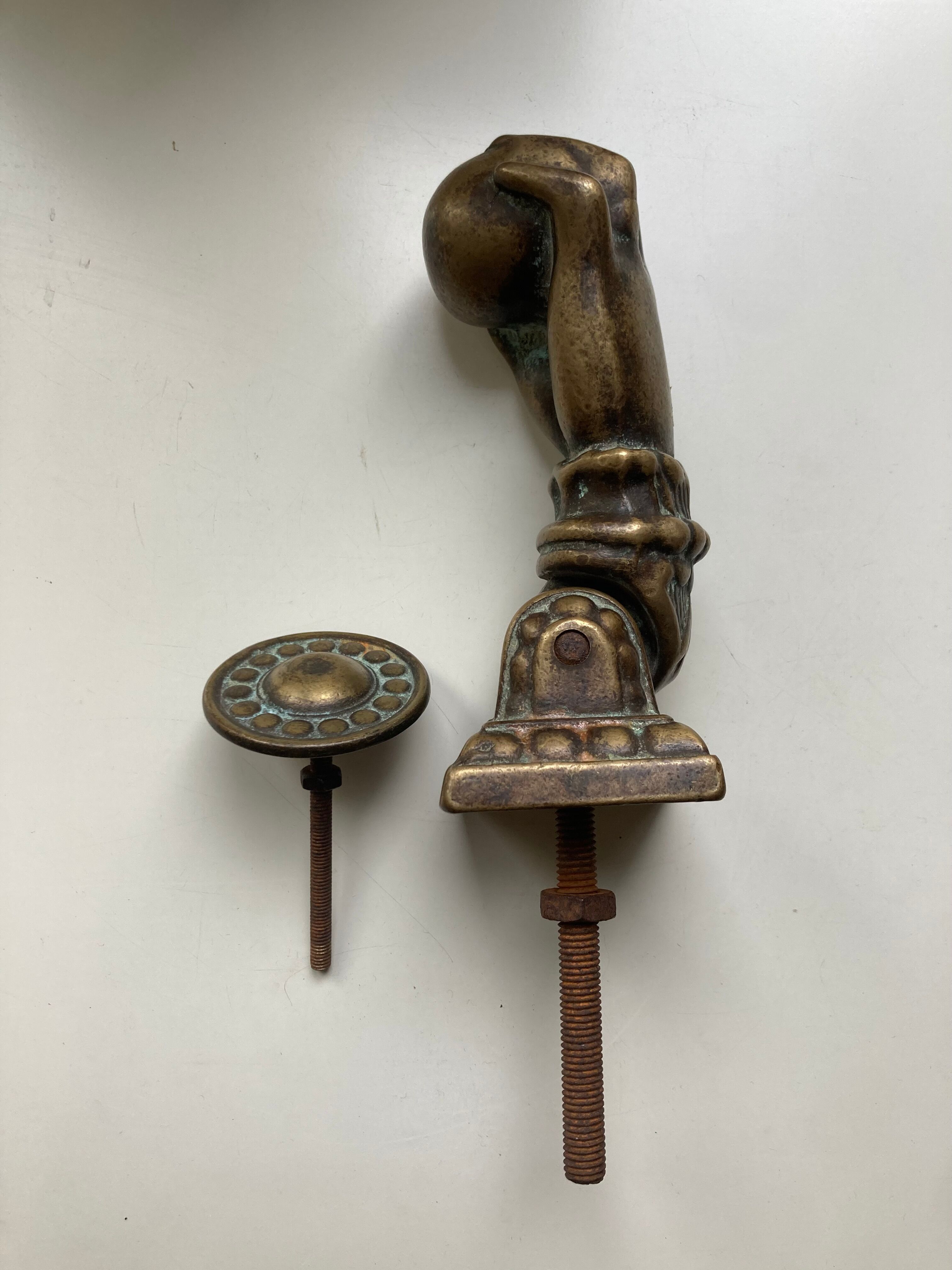 Antique bronze hand-shaped door knocker