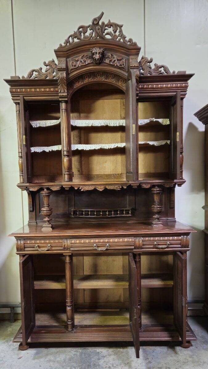 Important two-body buffet in solid walnut, richly carved in pure Renaissance style.