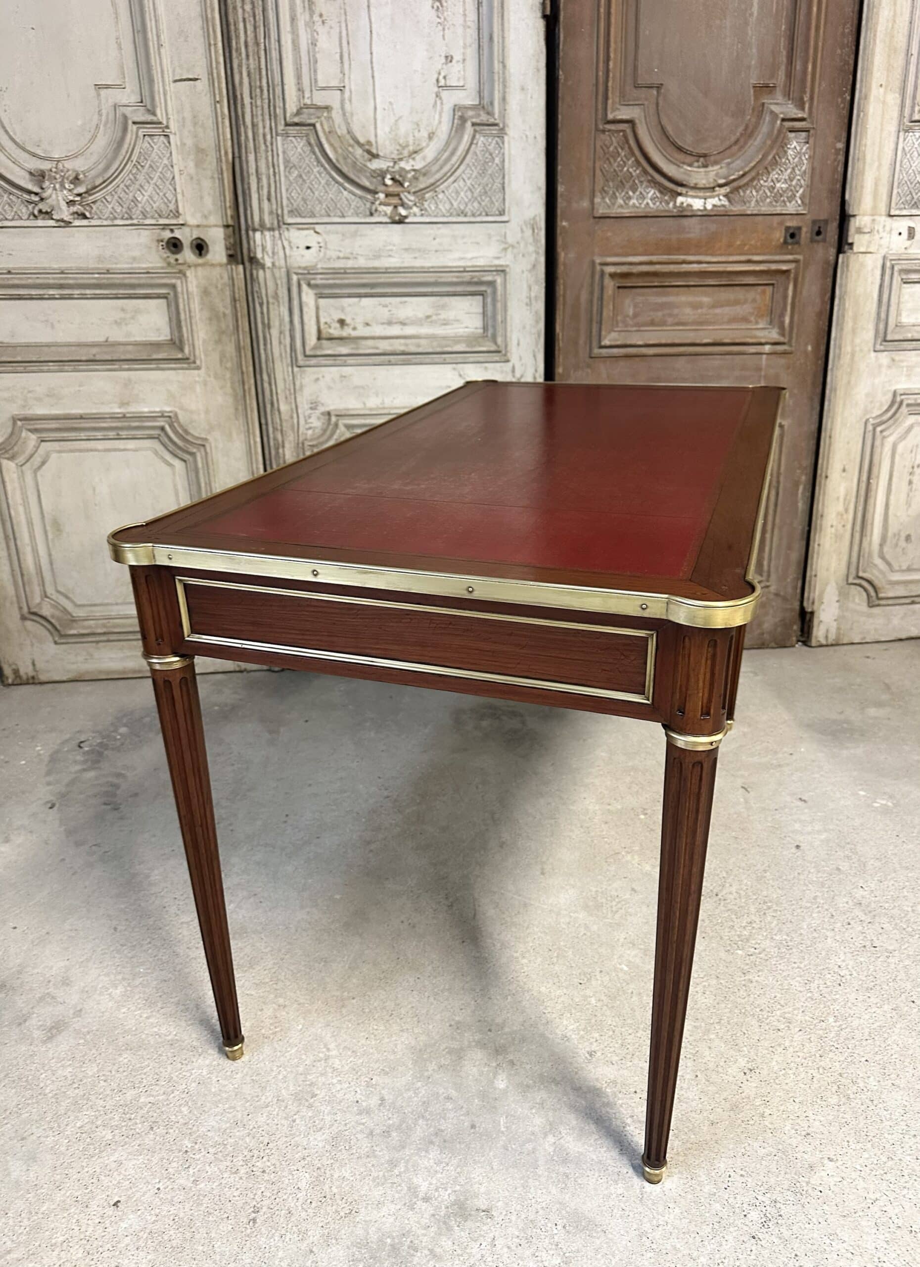 Louis XVI style flat desk in mahogany from around 1950.
