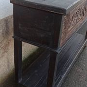 Console in old black wood with integrated chest