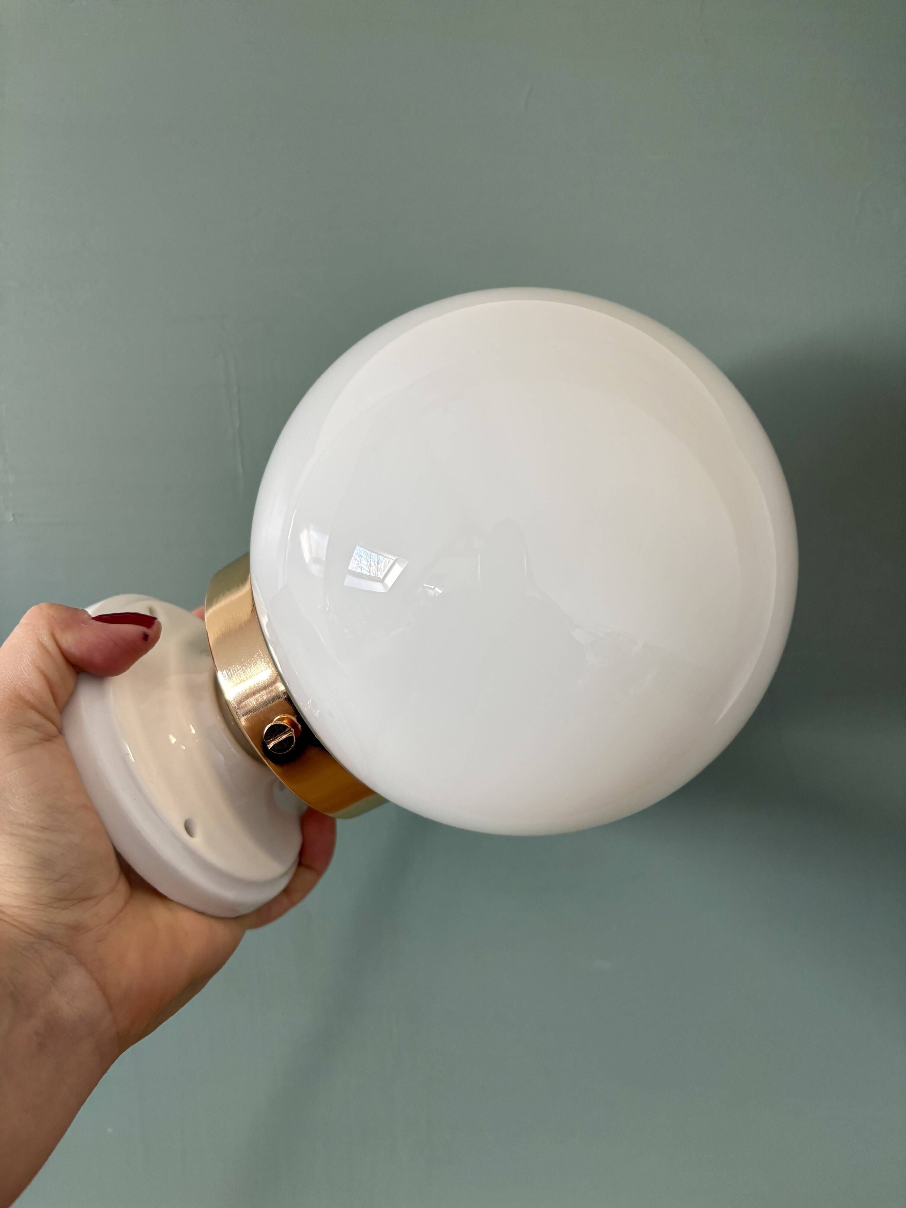 Vintage globe wall or ceiling light in white opaline.