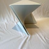 Pair of unmarked triangular white design stools