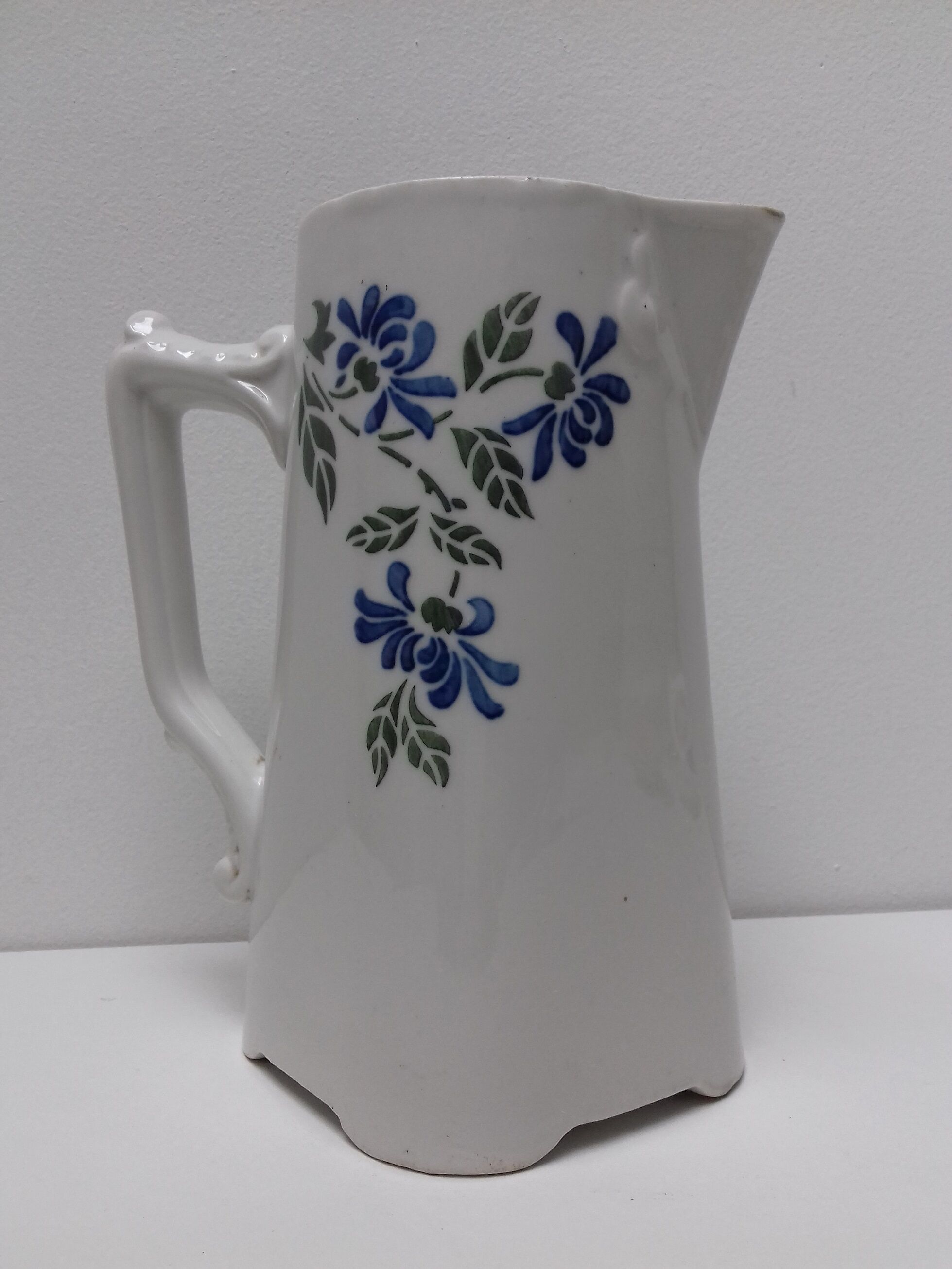 Ancient pitcher ceramic blue flowers
