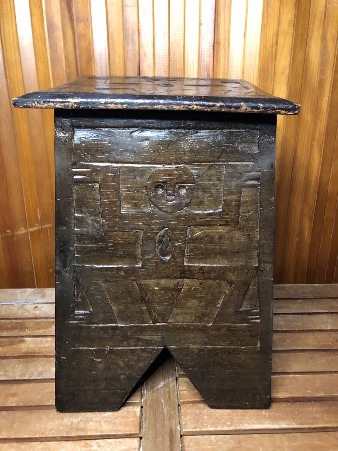 Old stool with vintage carved wood chest