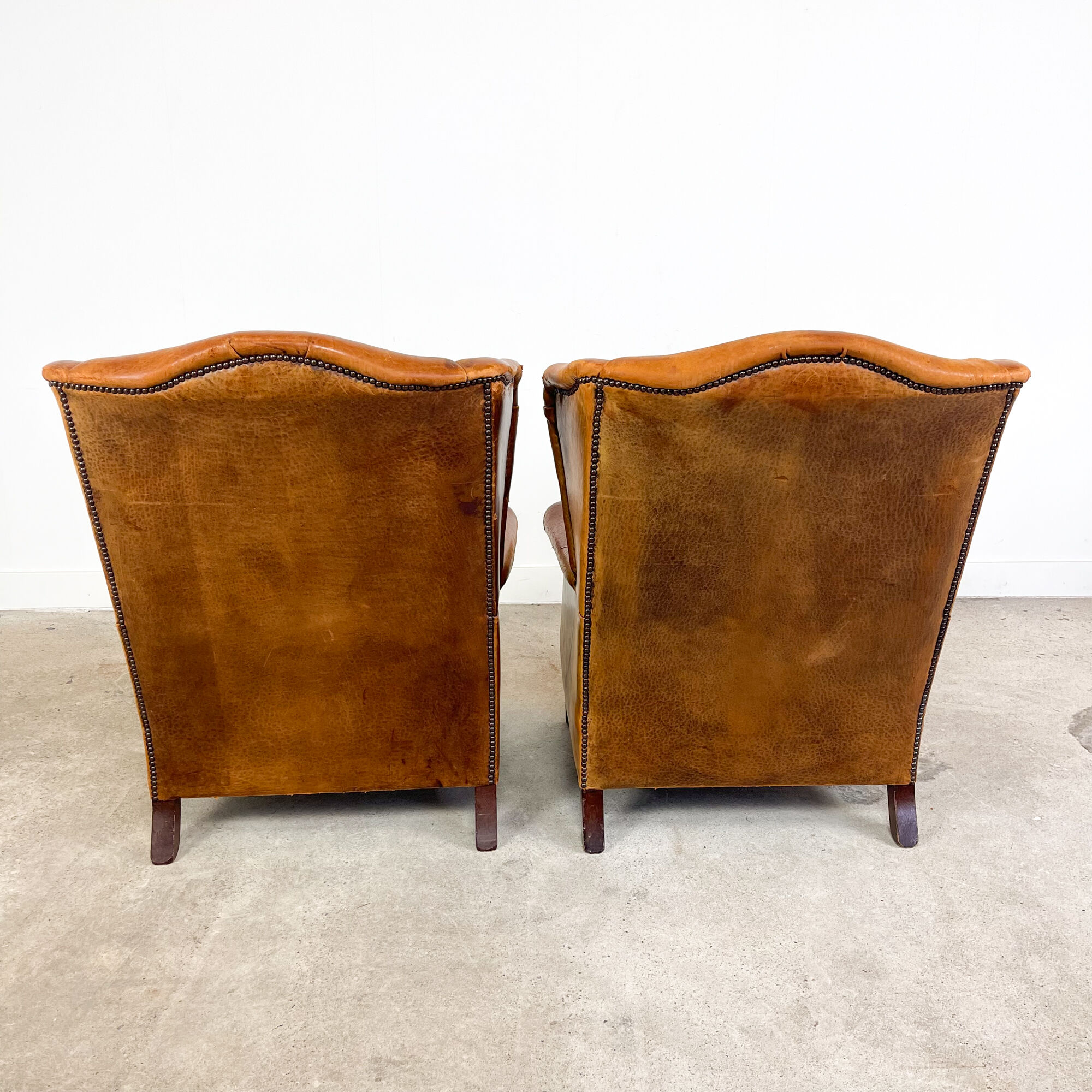 Set of two sheep leather wingback armchairs Delft