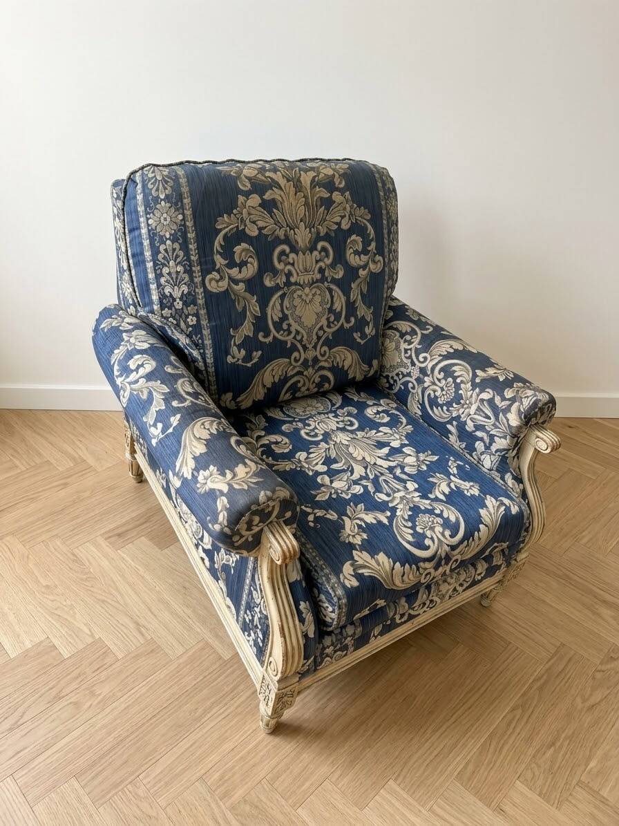 Pair of Armchairs, Louis XVI style, low model, white lacquered, blue fabric with royal decoration.