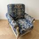 Pair of Armchairs, Louis XVI style, low model, white lacquered, blue fabric with royal decoration.