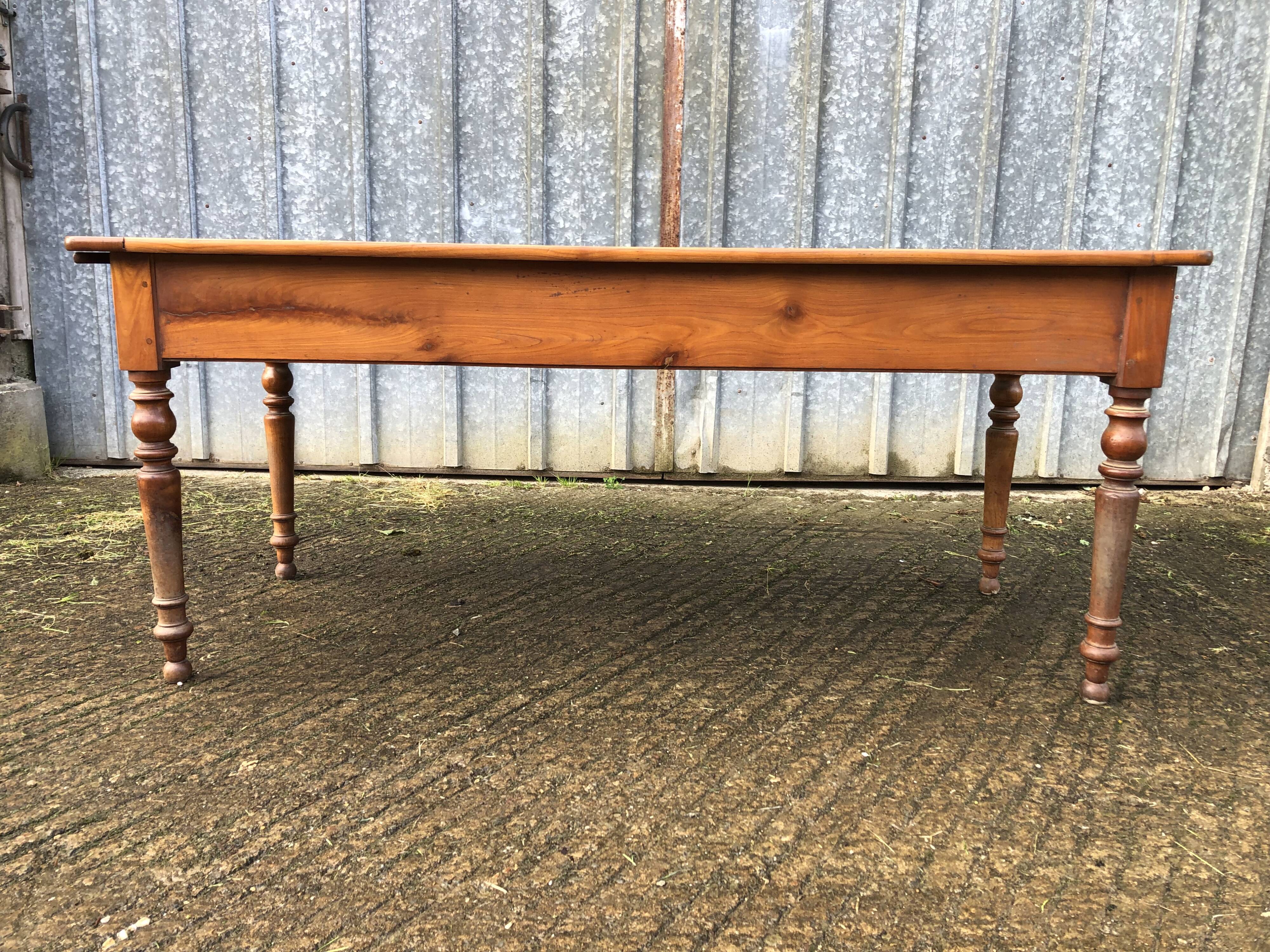 Antique farmhouse table in solid cherry wood in Louis Philippe style.