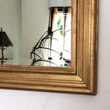 Large gold-framed mirror with bevelled glass.