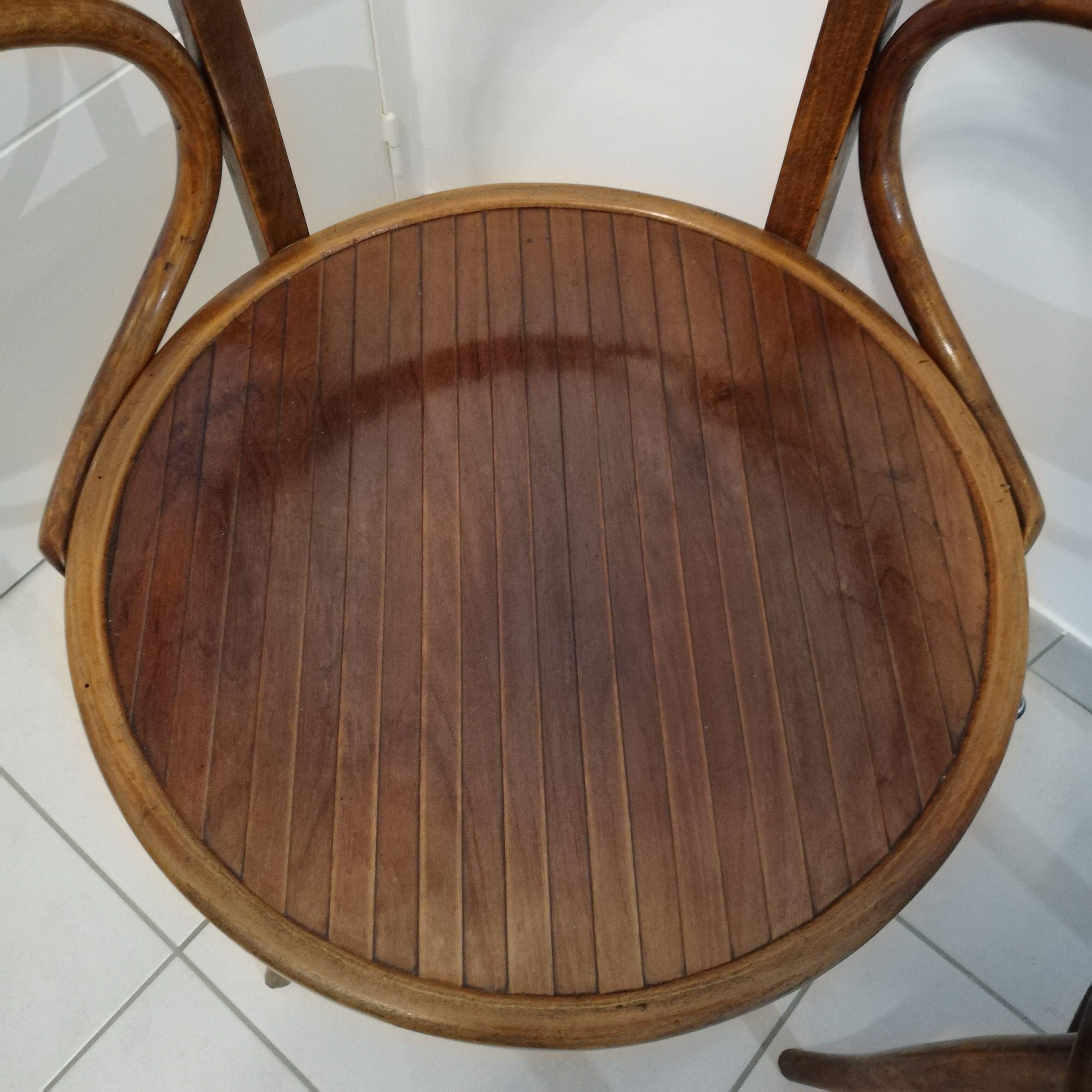 Pair of curved wooden armchairs