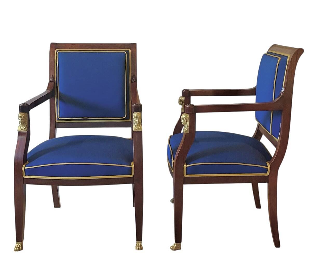 Pair of Empire style armchairs in mahogany and gilt bronze.